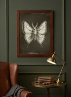 Dark Gothic Moth Illustration art print shown in a dark olive study setting
