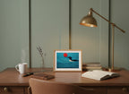 Minimalist Loon Bird Wall Art art print shown in a small desk oak setting