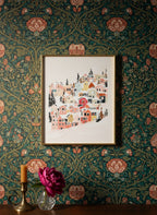 Winter Village Hillside Art art print shown in a maximalist floral brass setting