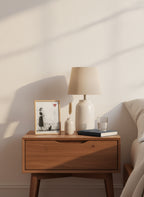 Woman Black Cat Heart Art art print shown in a small bedside oak setting