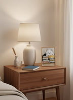 Cats and Books Illustration art print shown in a small bedside oak setting