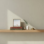 Minimalist Coastal Farmhouse Art art print shown in a small bookshelf brass setting