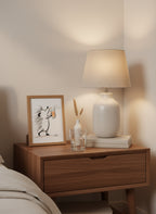 Hedgehog Beer Mug Art art print shown in a small bedside oak setting