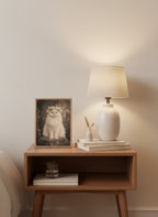 Vintage Persian Cat Floral Portrait art print shown in a small bedside oak setting