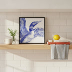 Blue Loon Bird Etching Art art print shown in a square kitchen open shelf setting