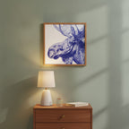 Blue Moose Engraving Art art print shown in a square bedside oak setting