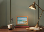 Coastal Family Figures Impressionist Art art print shown in a small desk oak setting