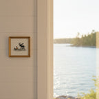 Boy and Moose Canoe Art art print shown in a shiplap blurred view setting