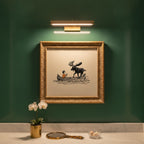 Boy and Moose Canoe Art art print shown in a square powder room emerald setting