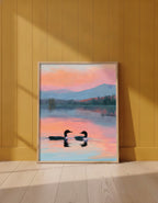Loon Pair Sunset Lake Art art print shown in a yellow wall setting