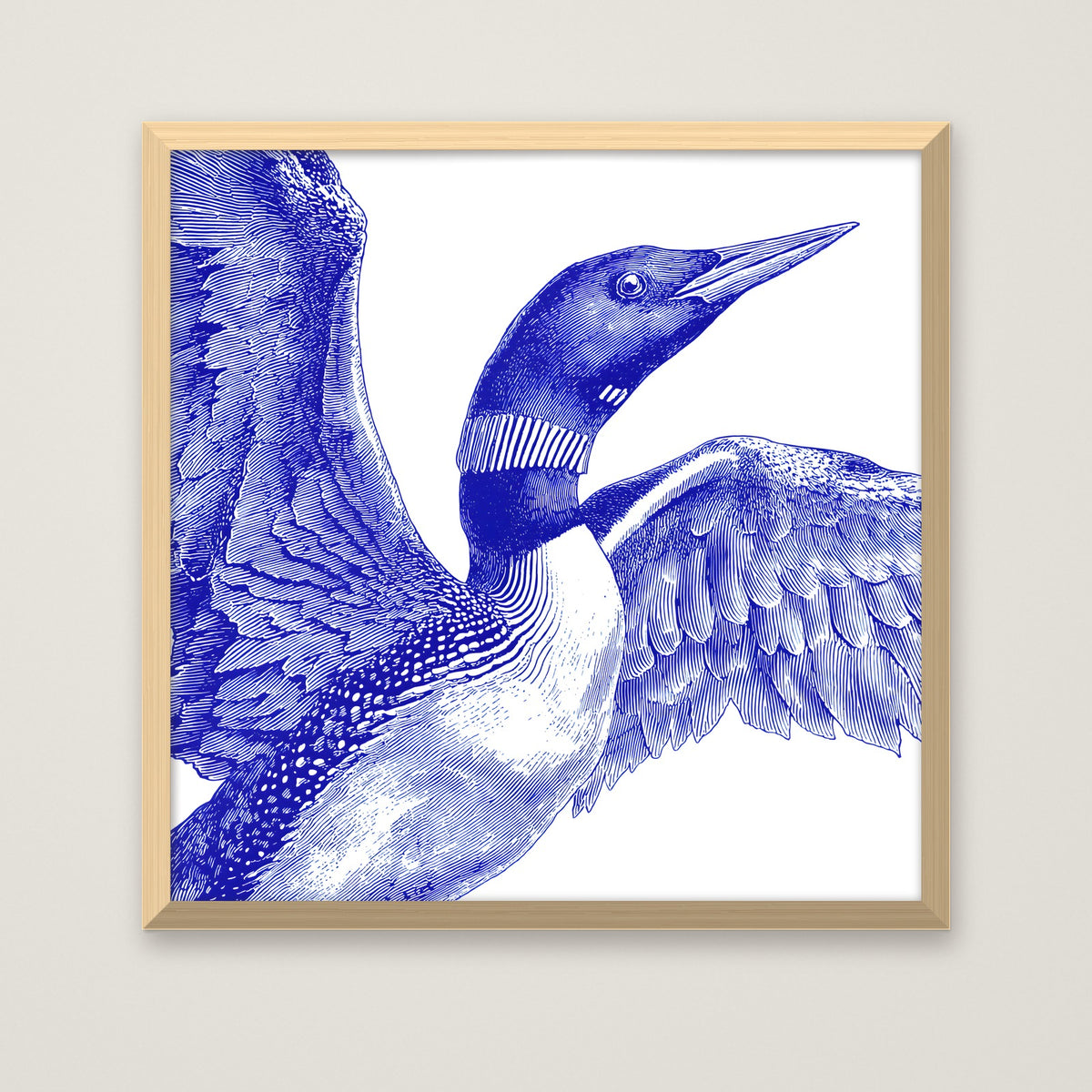 Blue Loon Bird Etching Art in a natural wood frame